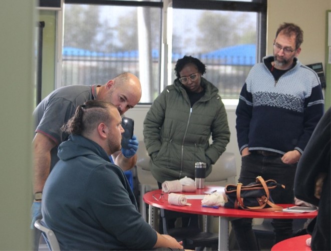 Group involved in a hands-on training or demonstration activity.