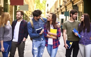 Group of friends walking together in a city, sharing smiles and books.