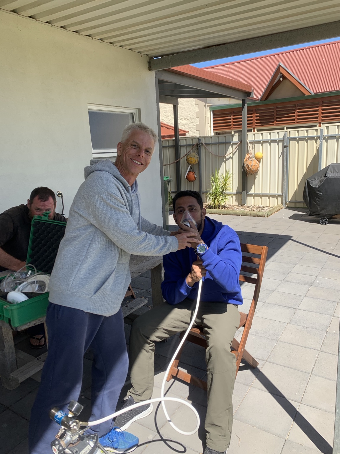 Oxygen cylinder safety training with a mask and regulator in Adelaide